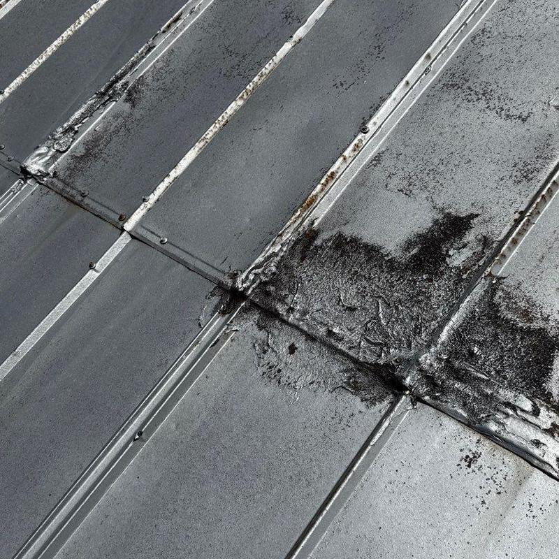 Metal roof panels with corrosion and wear damage