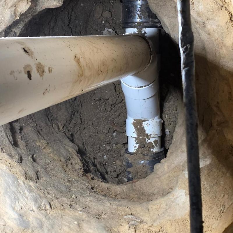 6-inch PVC sewer cleanout installed in excavation