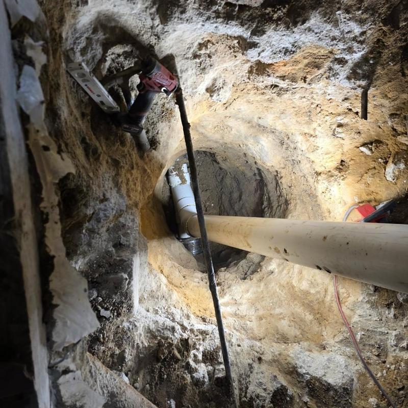 6-inch PVC sewer cleanout installation in deep excavation