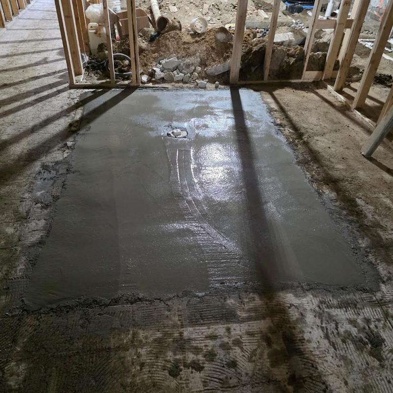 6-inch PVC cleanout with concrete patch in basement