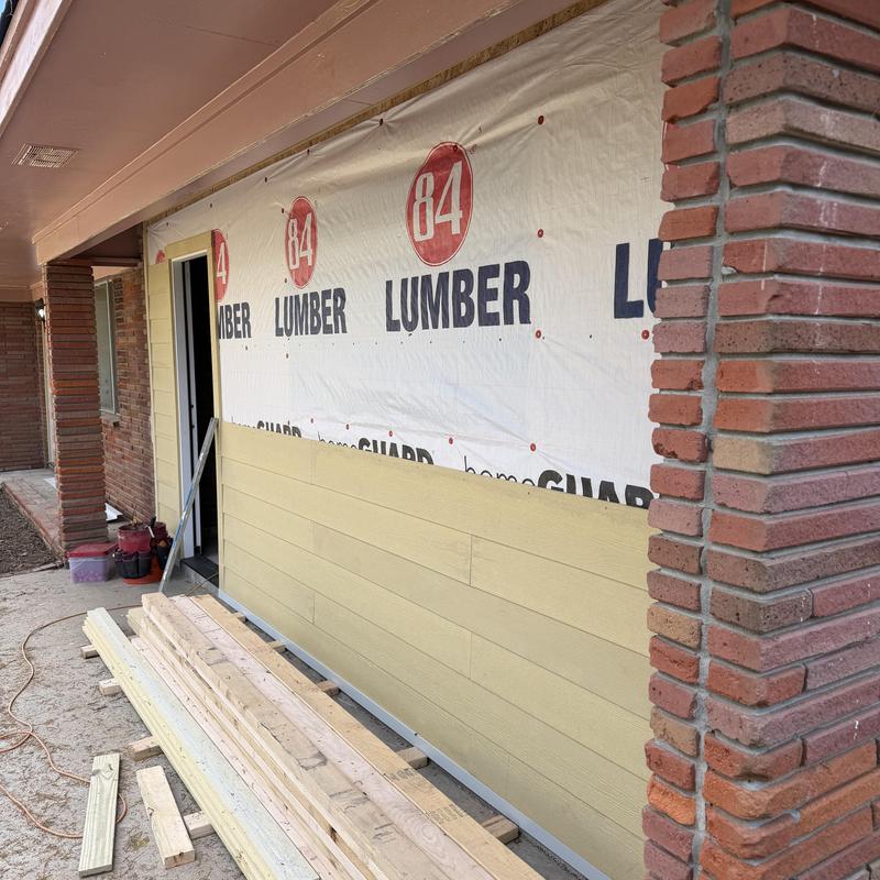 Hardie lap siding installation on house exterior