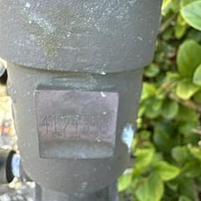 Backflow device with inspection tag and pipe fittings