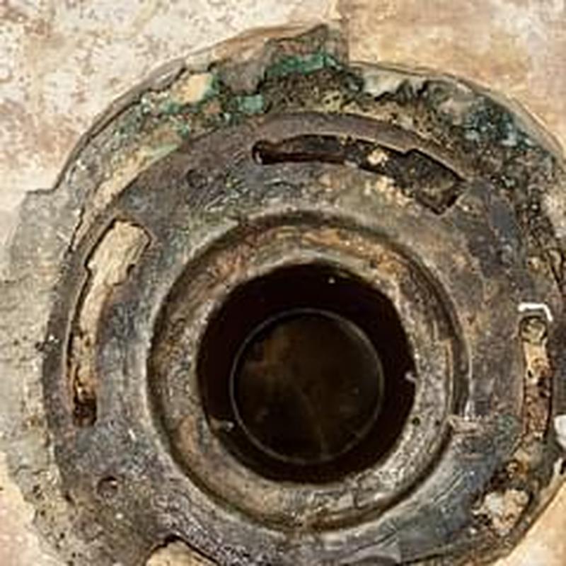 Toilet flange fitting on bathroom floor drain