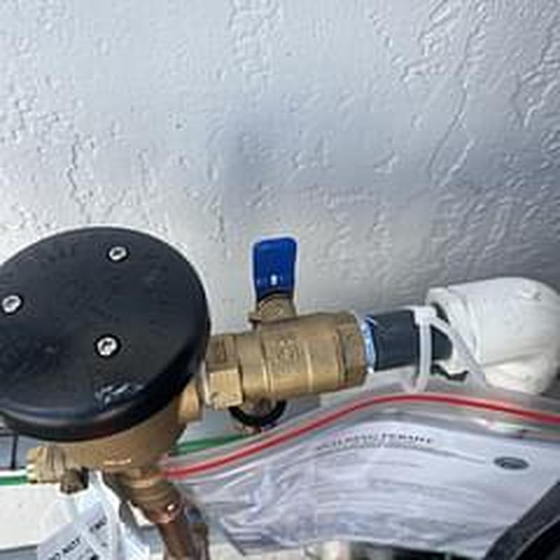 PVB backflow device on hose bib by pool equipment