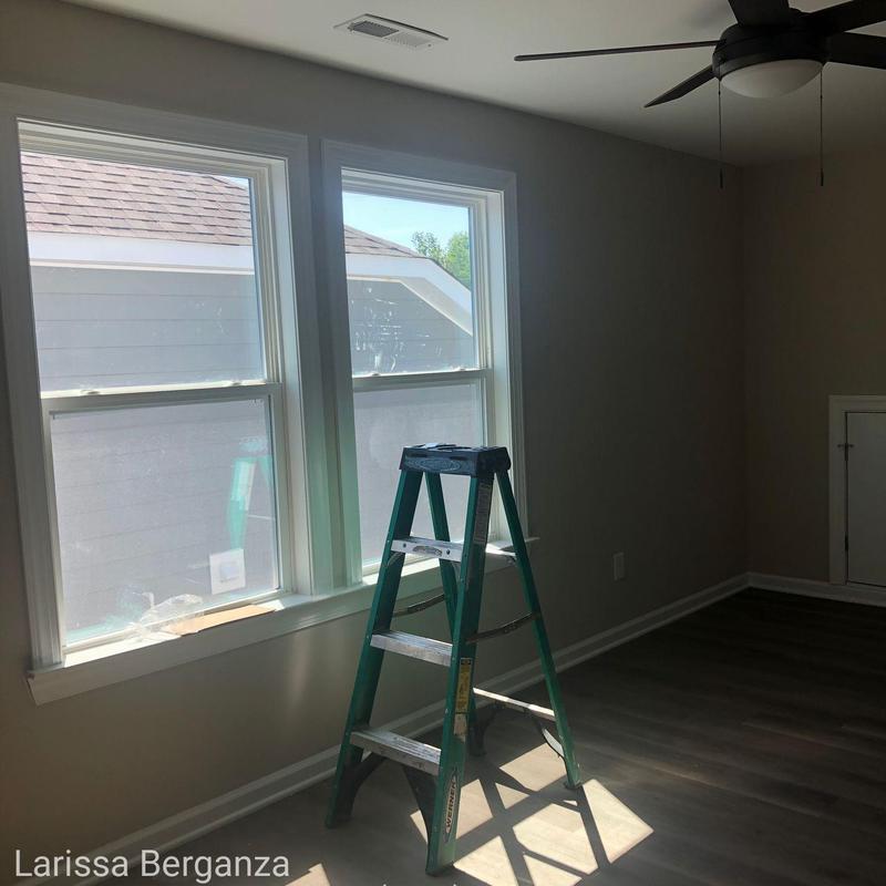 Window installation with ladder and ceiling fan nearby Window installation with ladder and ceiling fan nearby