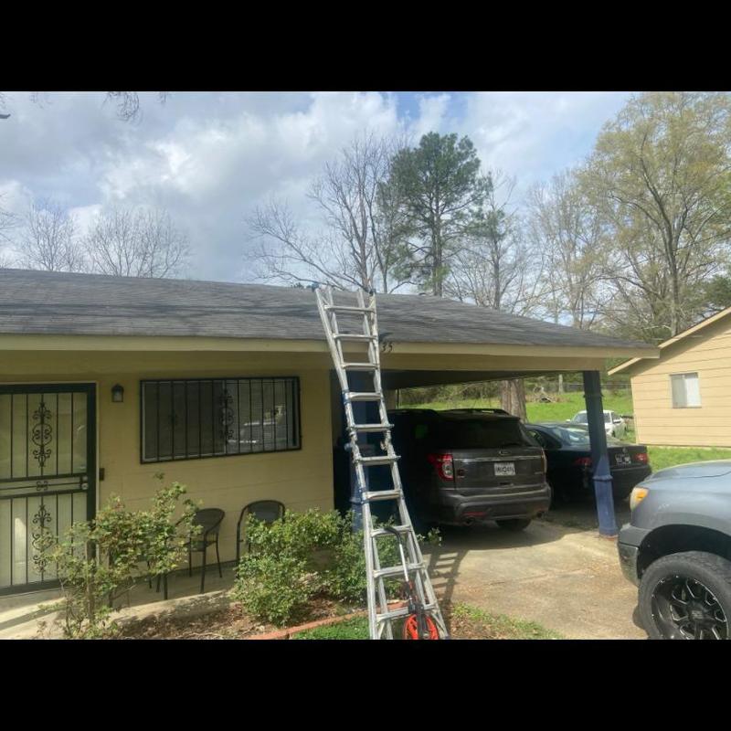 3-tab shingle roof with ladder and carport area