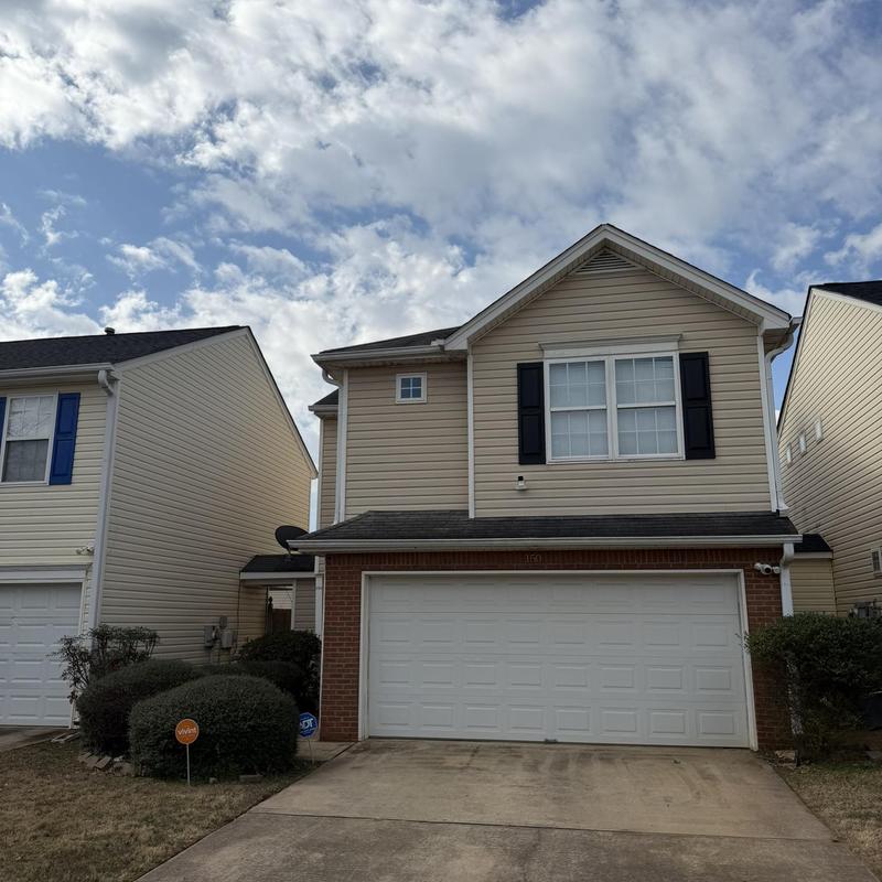 Asphalt shingles with missing and damaged ridge caps