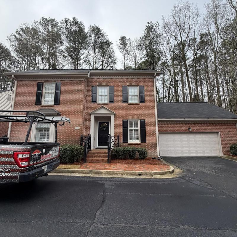 Gutter downspout extension replacement on brick home