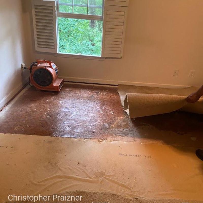 Carpet removal and drying fan in flooded room Carpet removal and drying fan in flooded room