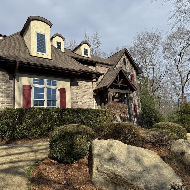 Owens Corning Duration Teak shingles on house roof Owens Corning Duration Teak shingles on house roof