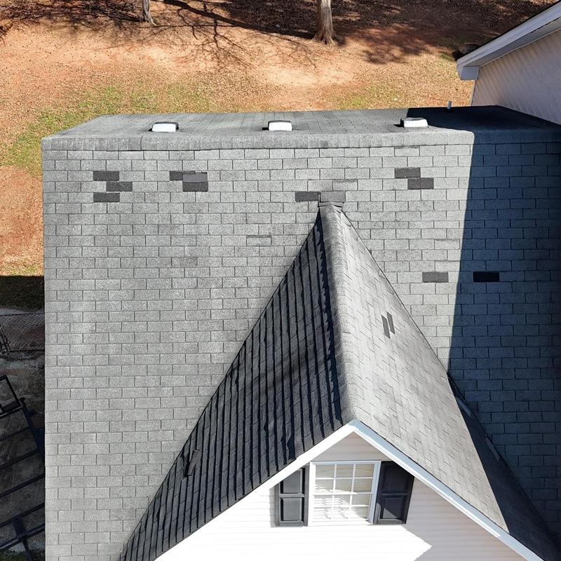 Pipe boots and shingles on gray roof