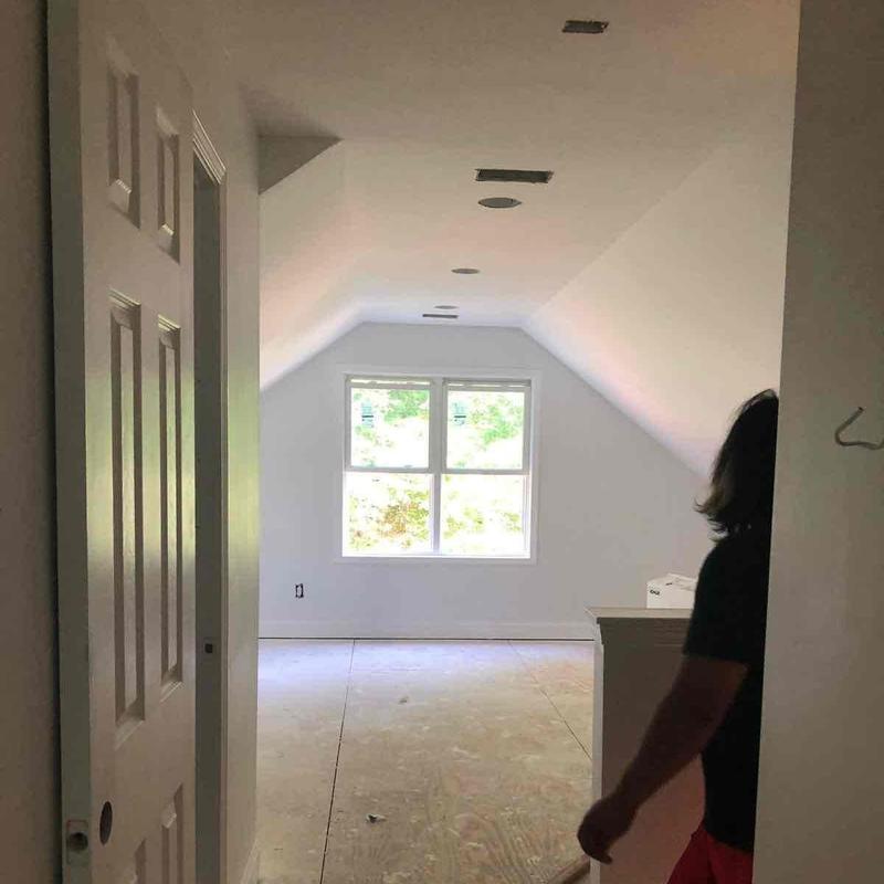 Attic room drywall and window installation in progress Attic room drywall and window installation in progress