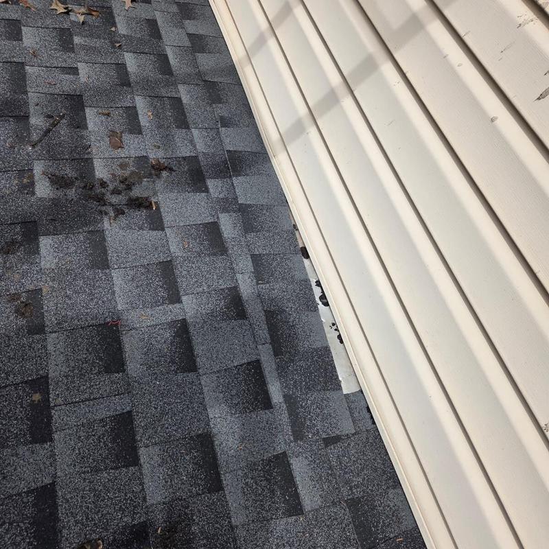 Roof shingles with caulked siding edge in Loganville, GA