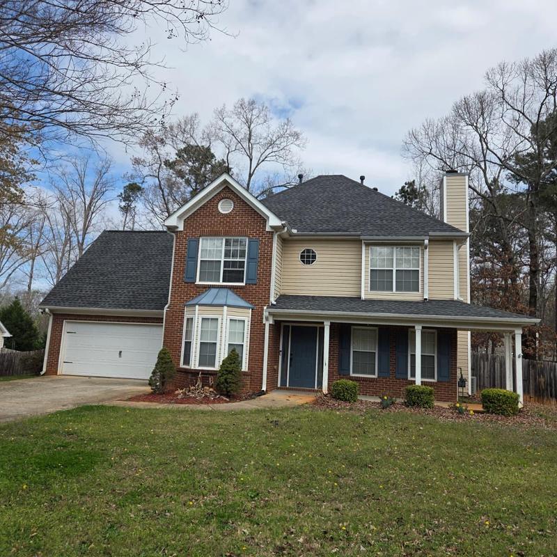 Roof shingles replacement and caulking on house exterior