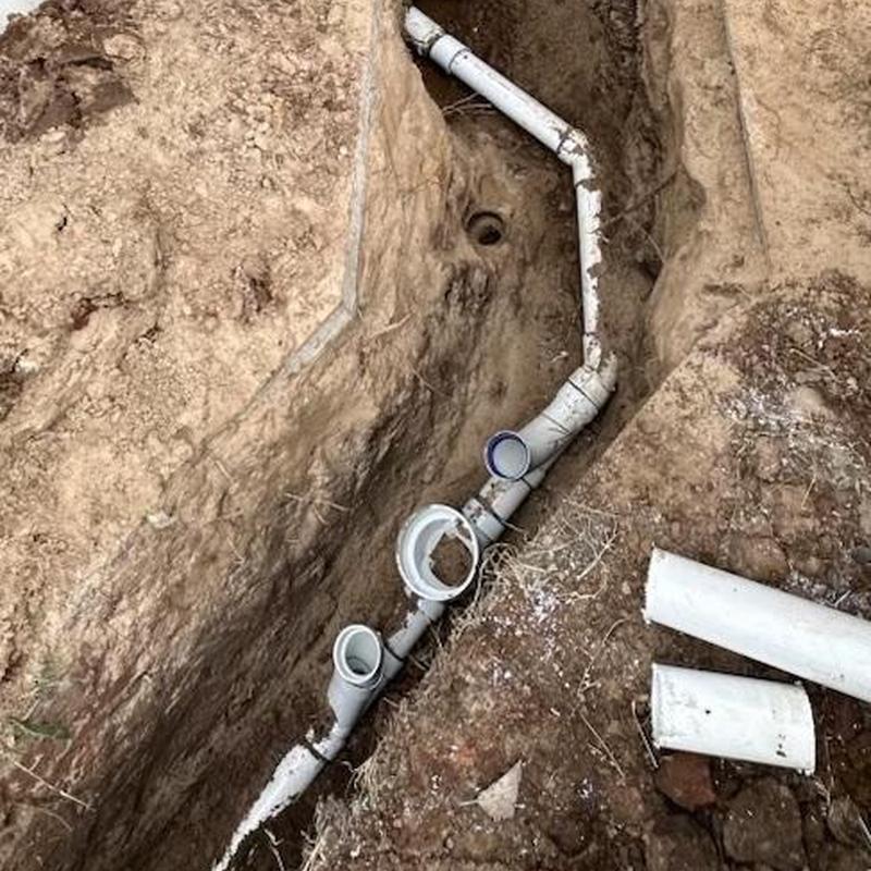 PVC sewer pipe installation in open trench