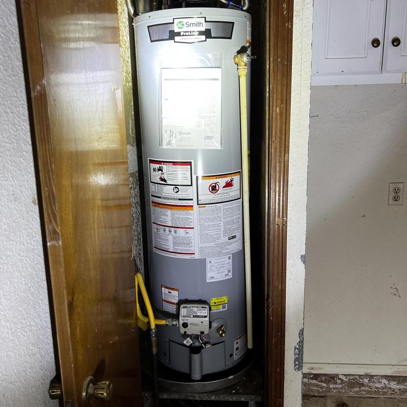 AO Smith natural gas water heater installation in closet
