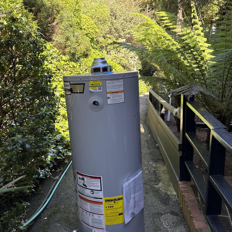 40-gallon water heater installed on outdoor pathway