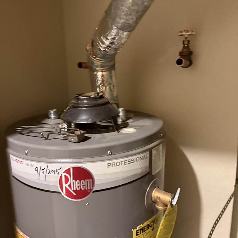 40-gallon Rheem water heater with vent pipe installation