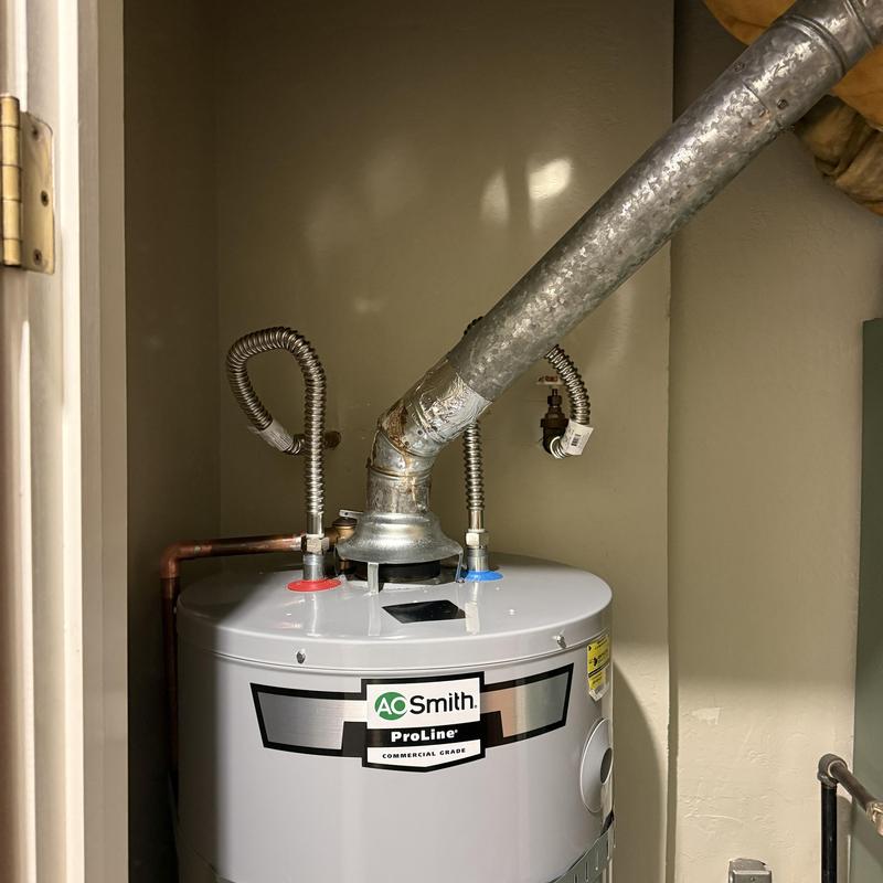 A.O. Smith Water Heater with Vent and Supply Lines
