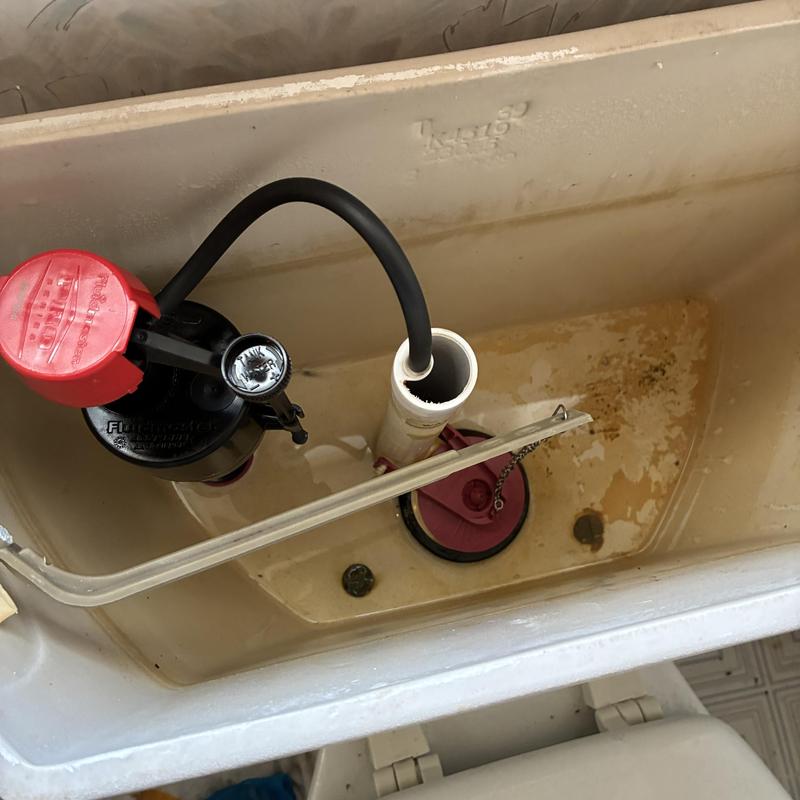 Toilet fill valve and flapper installation inside tank