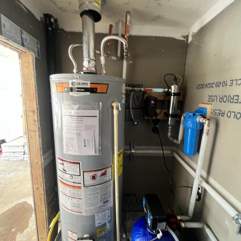 Water filtration system and water heater installation