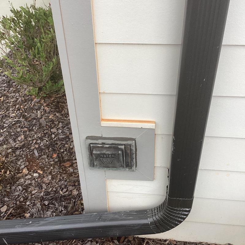 Outdoor water hose bib connection with protective cover