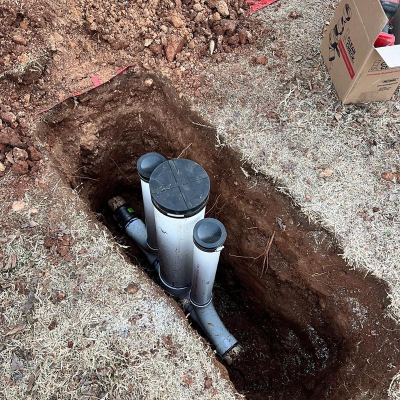 Sewer cleanouts and backflow preventer installation in soil