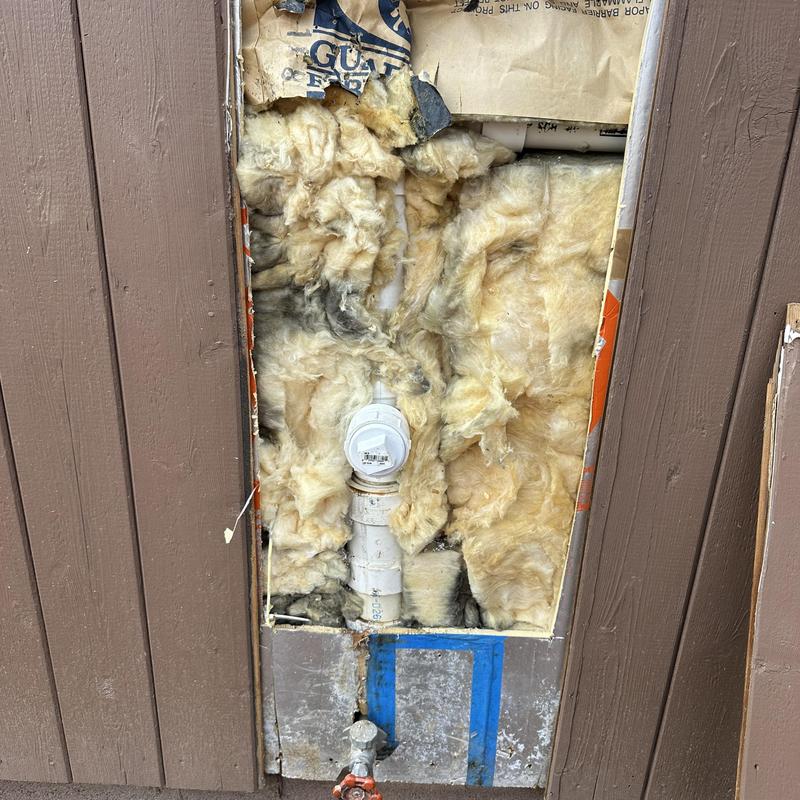 PVC cleanout pipe installation in wall cavity with insulation PVC cleanout pipe installation in wall cavity with insulation