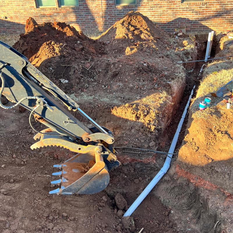 Sewer service line excavation and pipe replacement