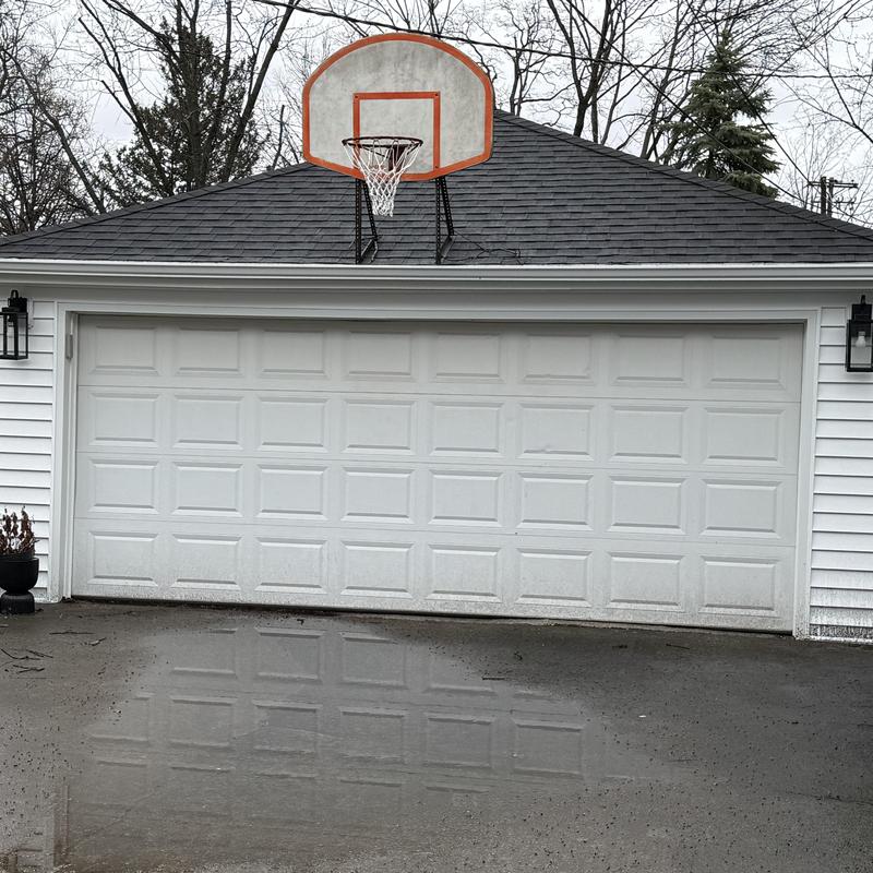 Vinyl siding and gutters on garage exterior