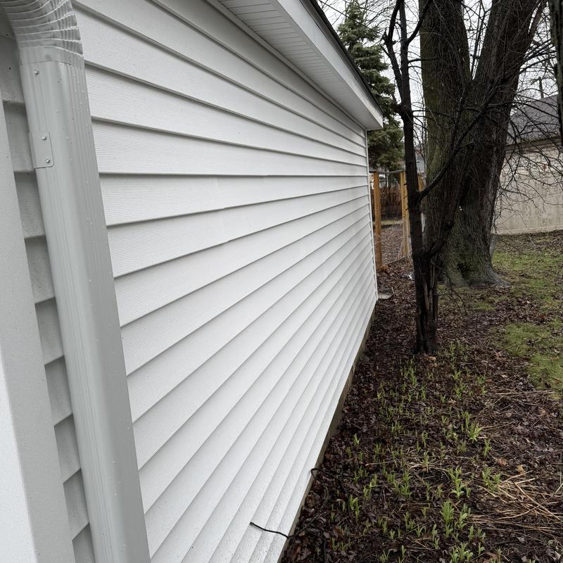 Alside vinyl siding and downspout on home exterior