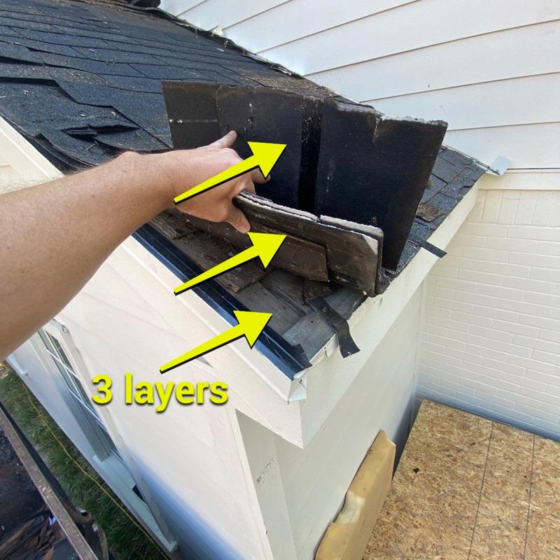 Three layers of roof shingles being removed Three layers of roof shingles being removed