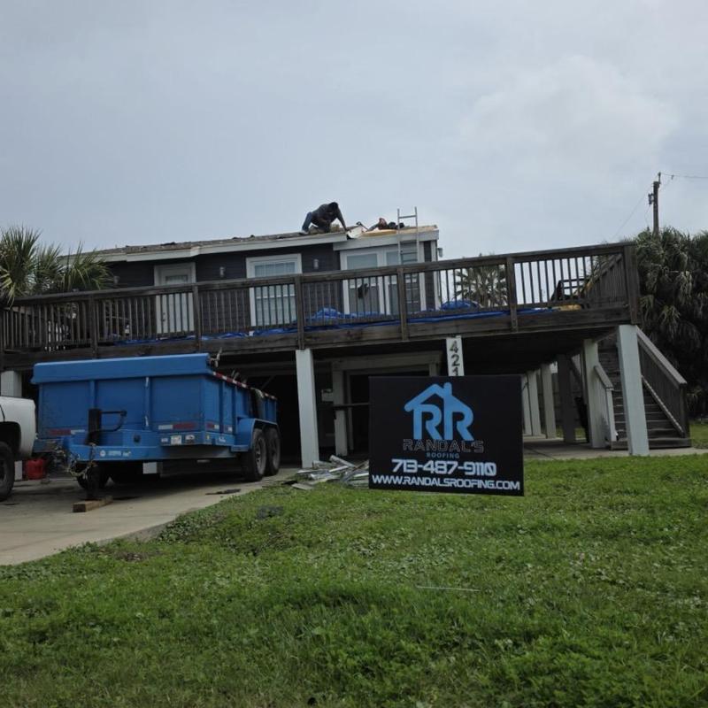 Asphalt shingle roofing installation on coastal home