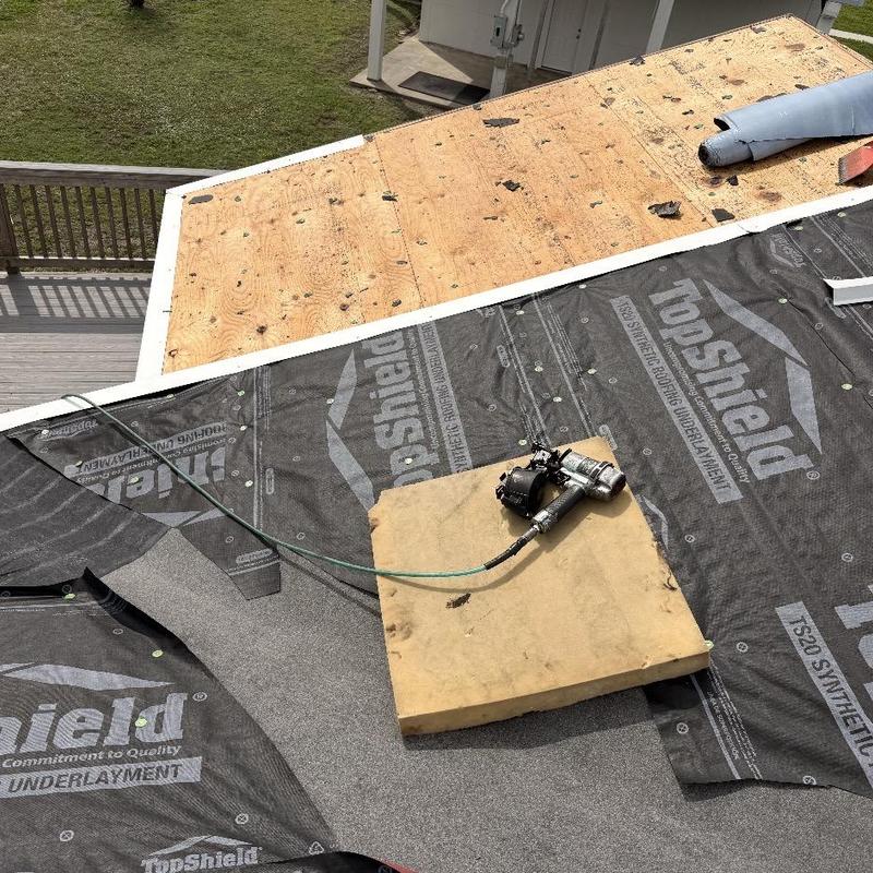 Synthetic roofing underlayment installation on plywood deck