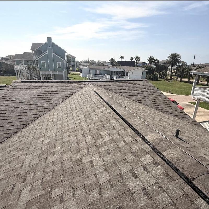 Asphalt shingle roof with ridge ventilation in Galveston