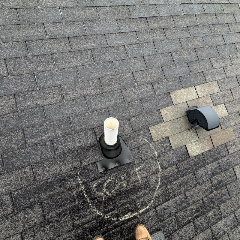 Pipe boot and surrounding shingles on roof