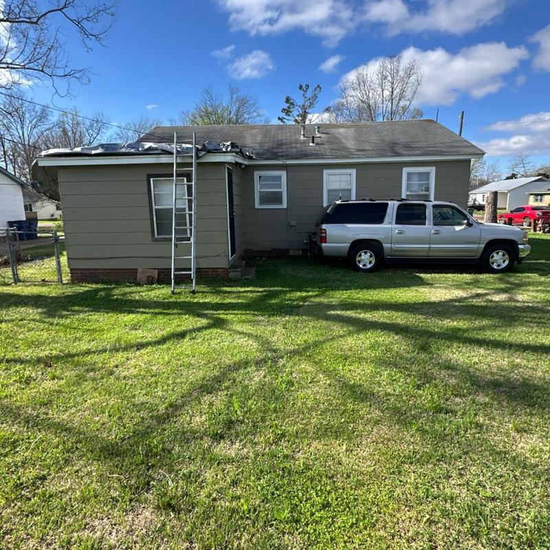 Asphalt shingle roof with ladder for inspection
