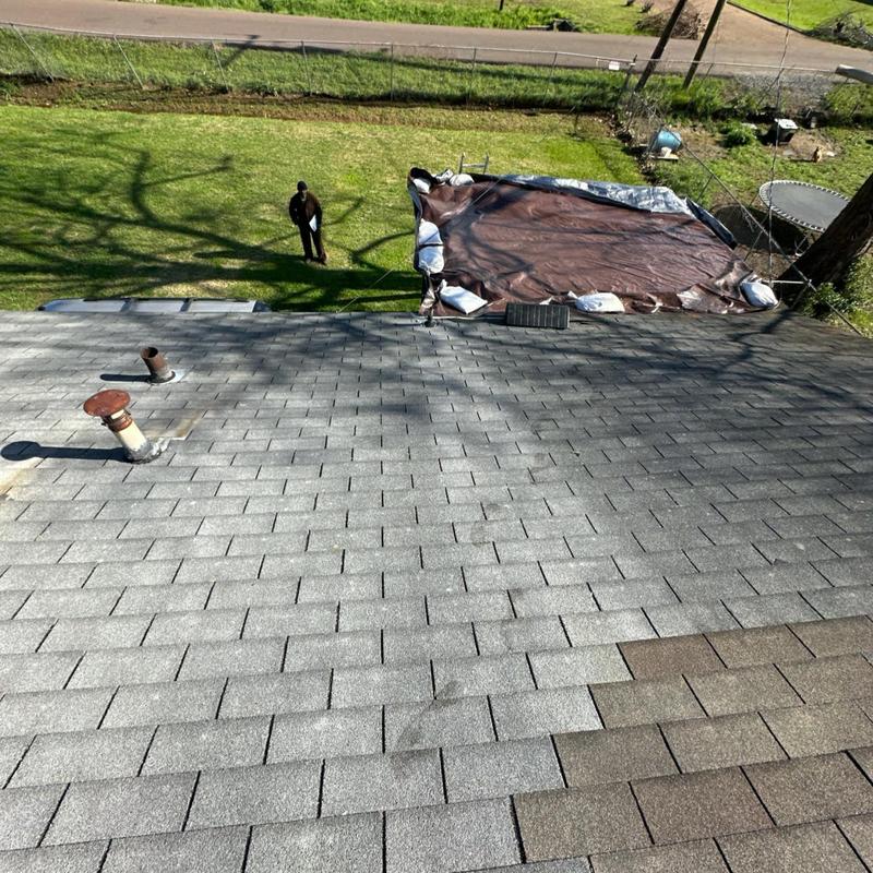 Roof shingles and vent pipe on residential roof