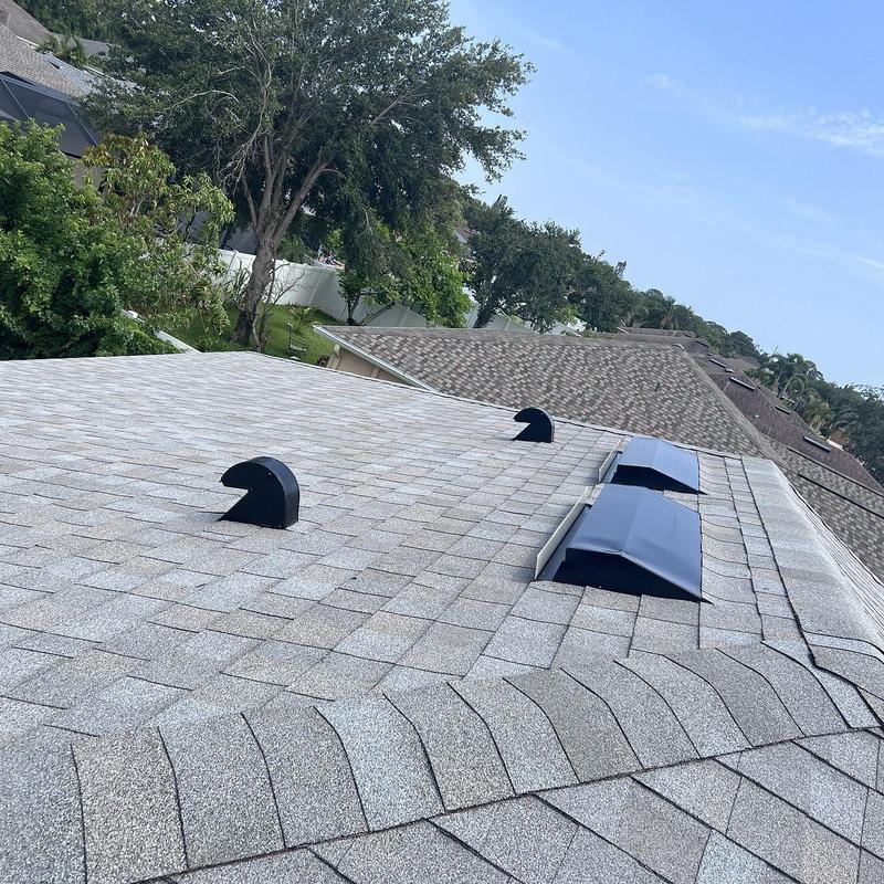 Atlas Pinnacle Sun architectural shingles roof with vents