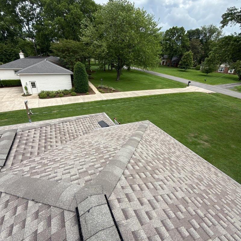 Asphalt shingle roof with hail damage inspection