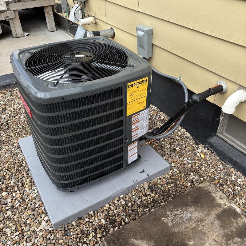 Goodman high efficiency air conditioner unit installed outdoors