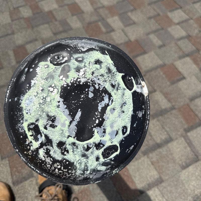 Roof vent cap with hail damage and corrosion marks