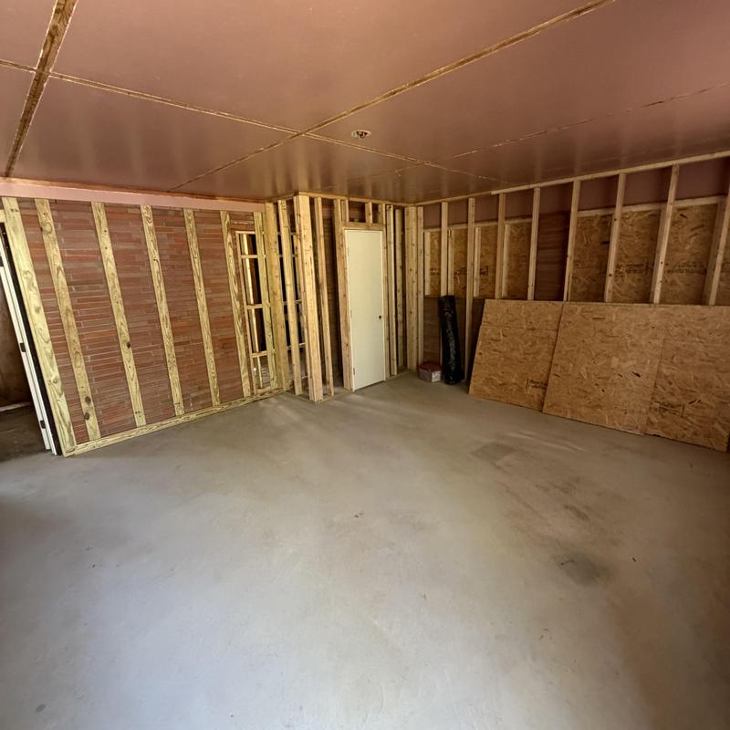 Garage framing and drywall installation for bedroom remodel