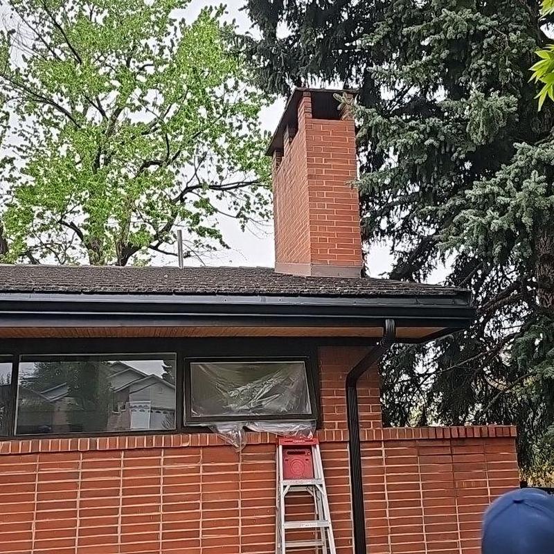 Chimney flashing and roof tile inspection on brick home Chimney flashing and roof tile inspection on brick home