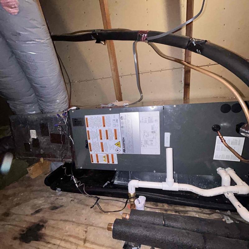 Air handler unit with ductwork and piping in attic