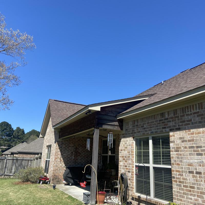 Soffit and fascia prep and painting on brick house exterior