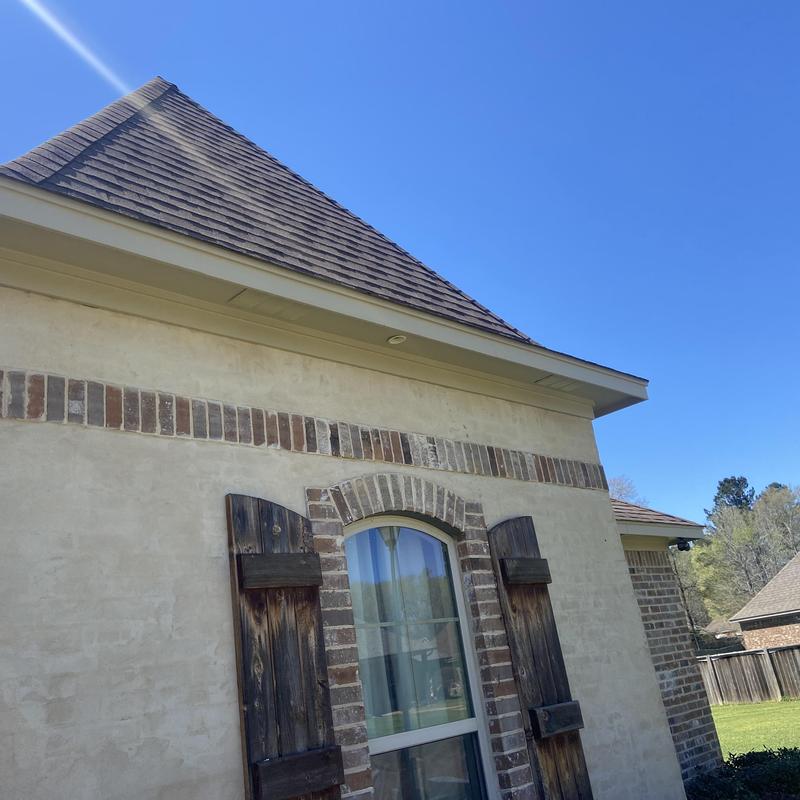 Soffit and fascia with fresh paint under roof edge