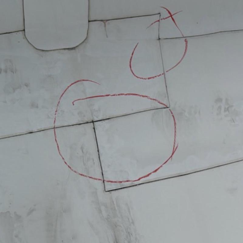 TPO commercial roof damage marked for inspection