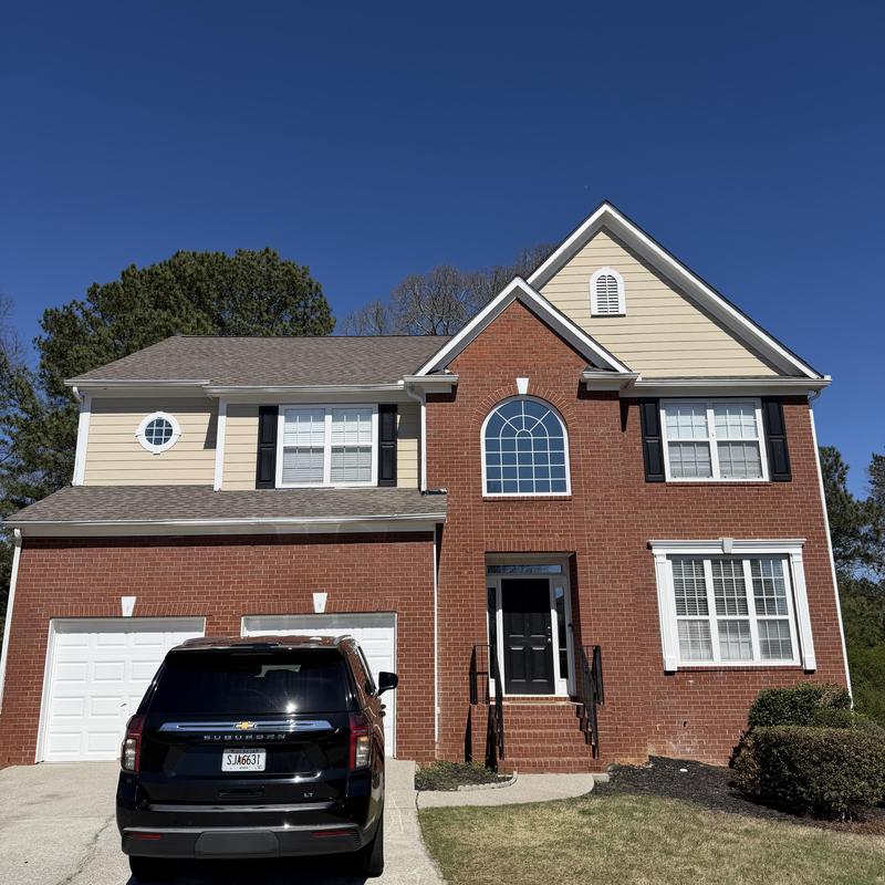 Pipe boot leak inspection on three-story brick house