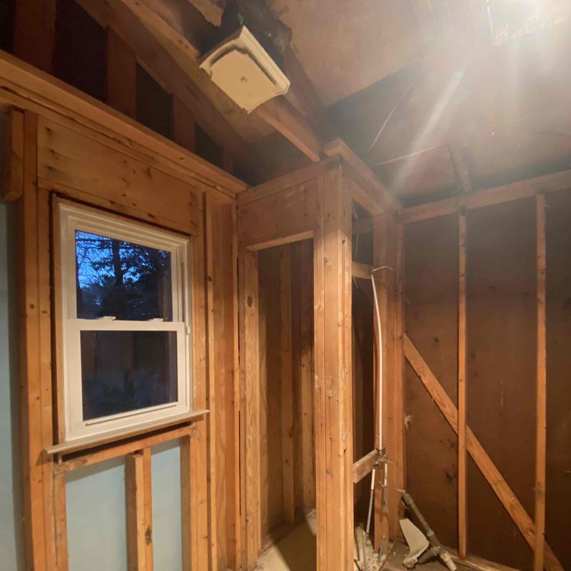 Bathroom wall framing and window installation in progress